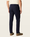 Back view of model wearing Dark Pebble Workday Khakis, Slim Fit.