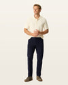 Front view of model wearing Dark Pebble Workday Khakis, Slim Fit.