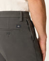 Side view of model wearing Storm Workday Khakis, Slim Fit.