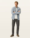 Front view of model wearing Storm Workday Khakis, Slim Fit.