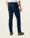 Back view of model wearing Navy Easy Khakis, Slim Fit.