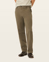Back view of model wearing Dark Pebble Workday Khakis, Classic Fit.