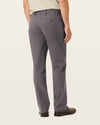 Side view of model wearing Storm Workday Khakis, Classic Fit.