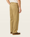 Back view of model wearing New British Khaki Signature Iron Free Khakis, Relaxed Fit with Stain Defender®.