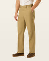 Side view of model wearing New British Khaki Signature Iron Free Khakis, Relaxed Fit with Stain Defender®.