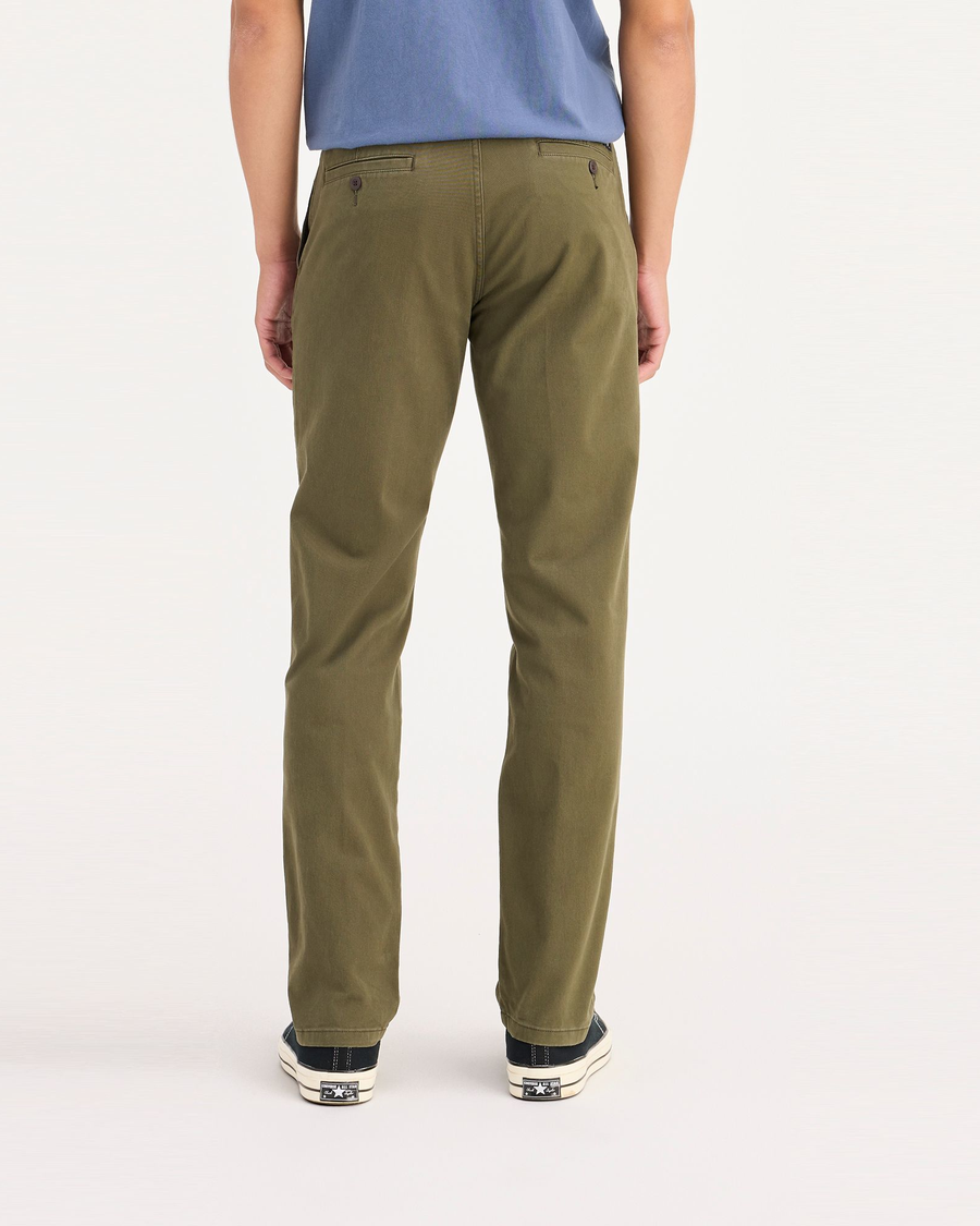 Back view of model wearing Army Olive Ultimate Chinos, Slim Fit.