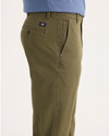 Side view of model wearing Army Olive Ultimate Chinos, Slim Fit.