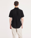 Back view of model wearing Beautiful Black Signature Stain Defender Shirt, Classic Fit.