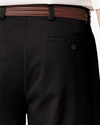 View of model wearing Black Easy Stretch Khakis, Pleated, Relaxed Fit.