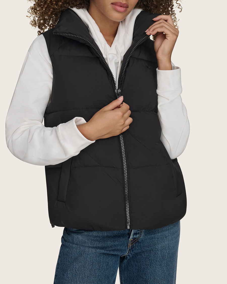 View of model wearing Black Hooded Matte Bubble Puffer Vest.