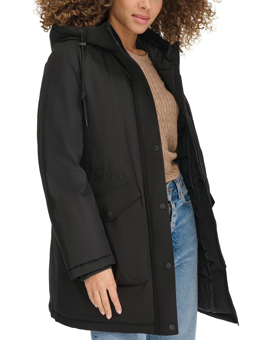 View of model wearing Black Hooded Parka.