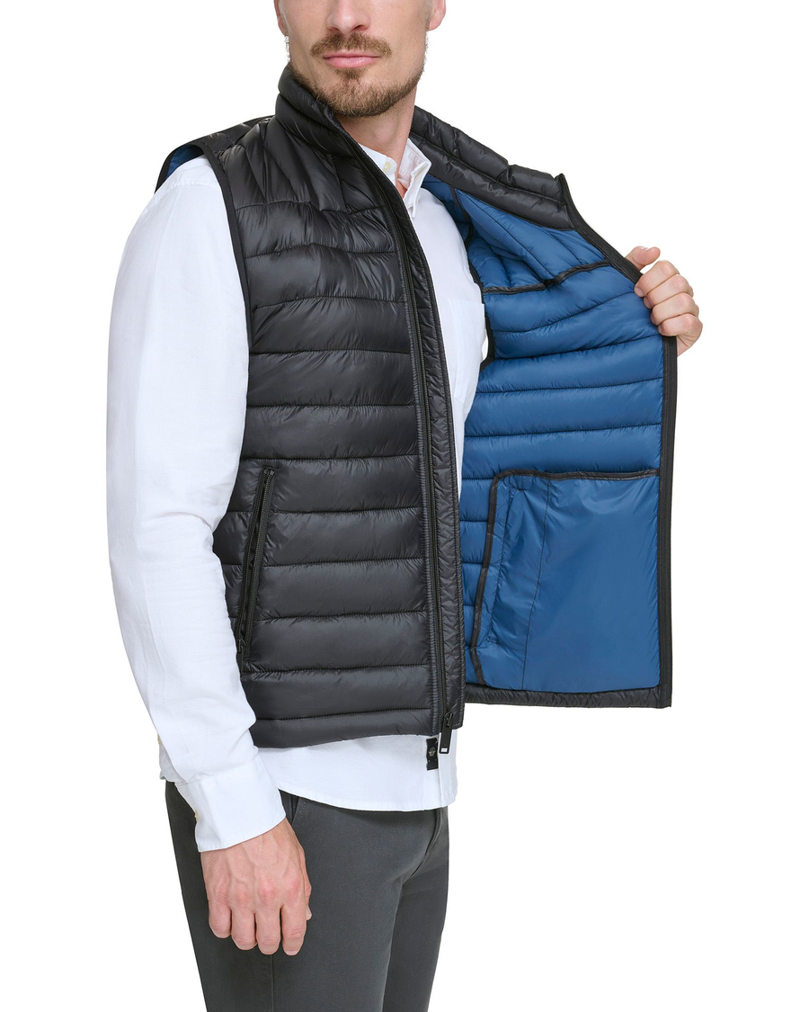 View of model wearing Black Lightweight Nylon Packable Vest.