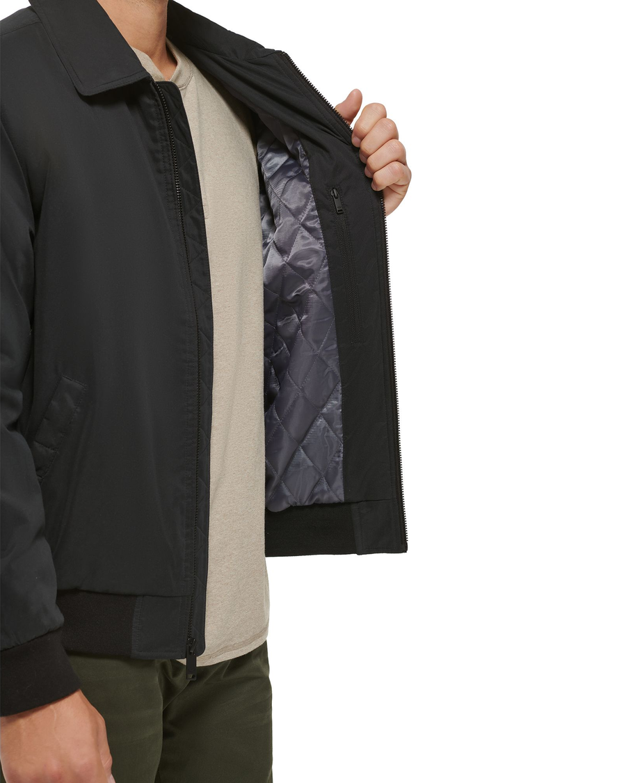 View of model wearing Black Microtwill Relaxed Laydown Collar Bomber.