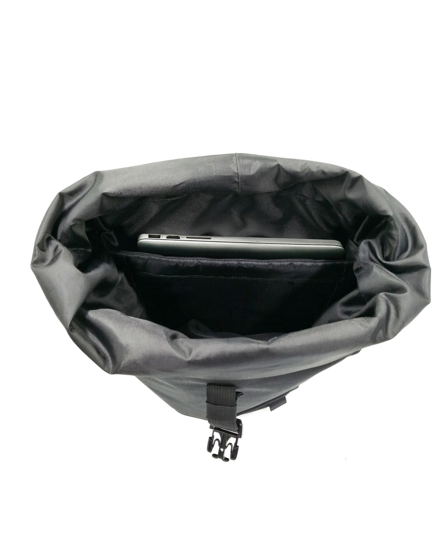 View of model wearing Black Roll Up Backpack, 23 L.