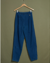 Back view of model wearing Blue Made in USA, Double Pleated Denim Pants - 26 x 30.