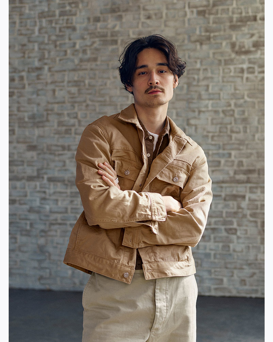 View of model wearing Broad Khaki Dockers® x Transnomadica Button-Down Shirt.