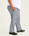 Side view of model wearing Burma Grey Signature Khakis, Pleated, Classic Fit (Big and Tall).