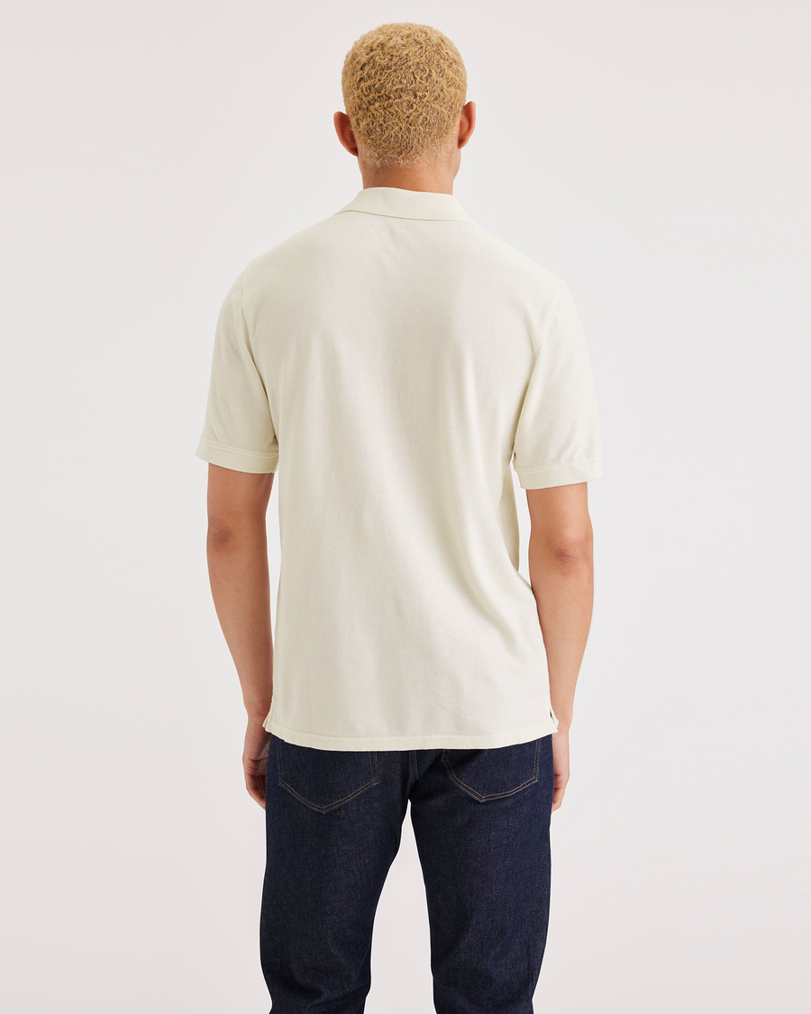 Back view of model wearing Buttercream Rib Collar Polo, Slim Fit.