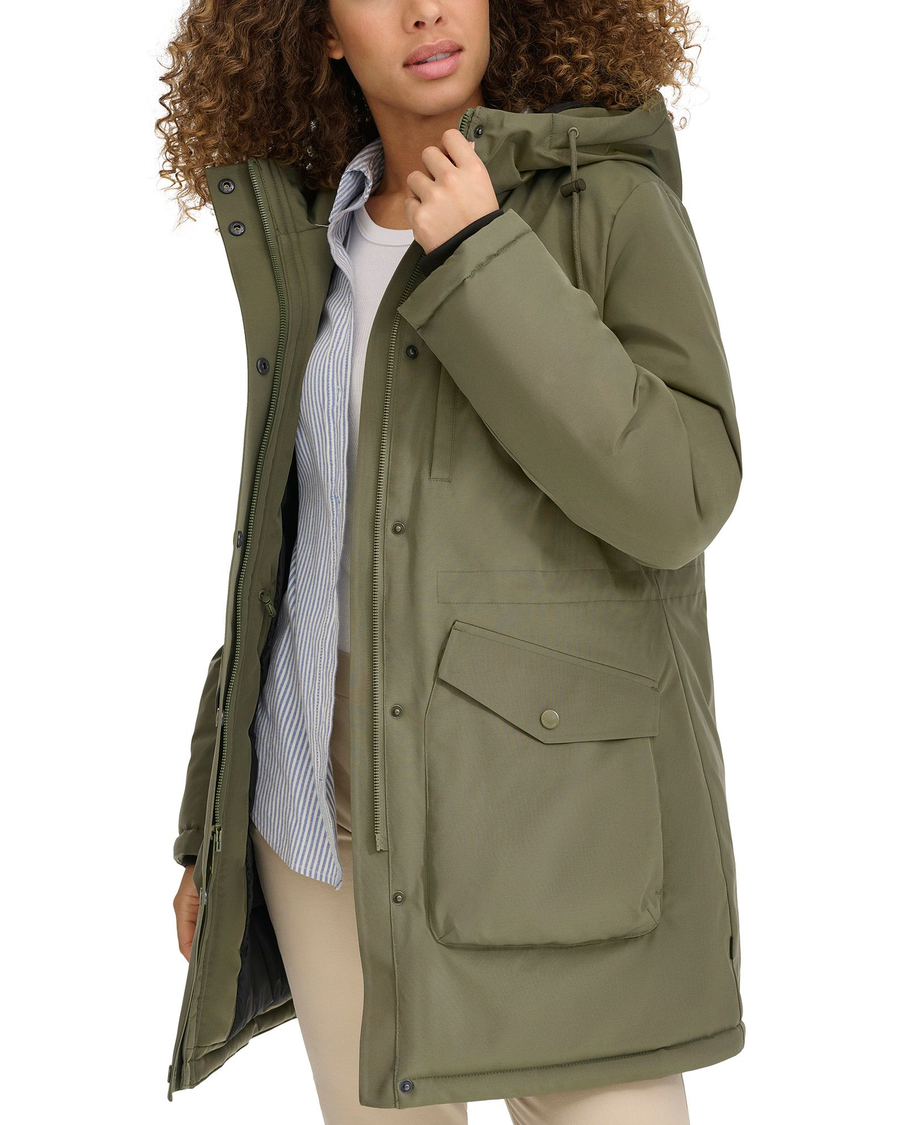 View of model wearing Camo Olive Hooded Parka.