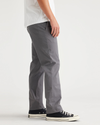 Side view of model wearing Car Park Grey Essential Chinos, Slim Fit.