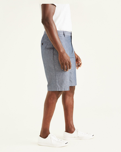 Side view of model wearing Clarke Chambray Faded Navy Perfect 10.5" Shorts.