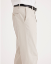 Side view of model wearing Cloud Signature Khakis, Classic Fit.