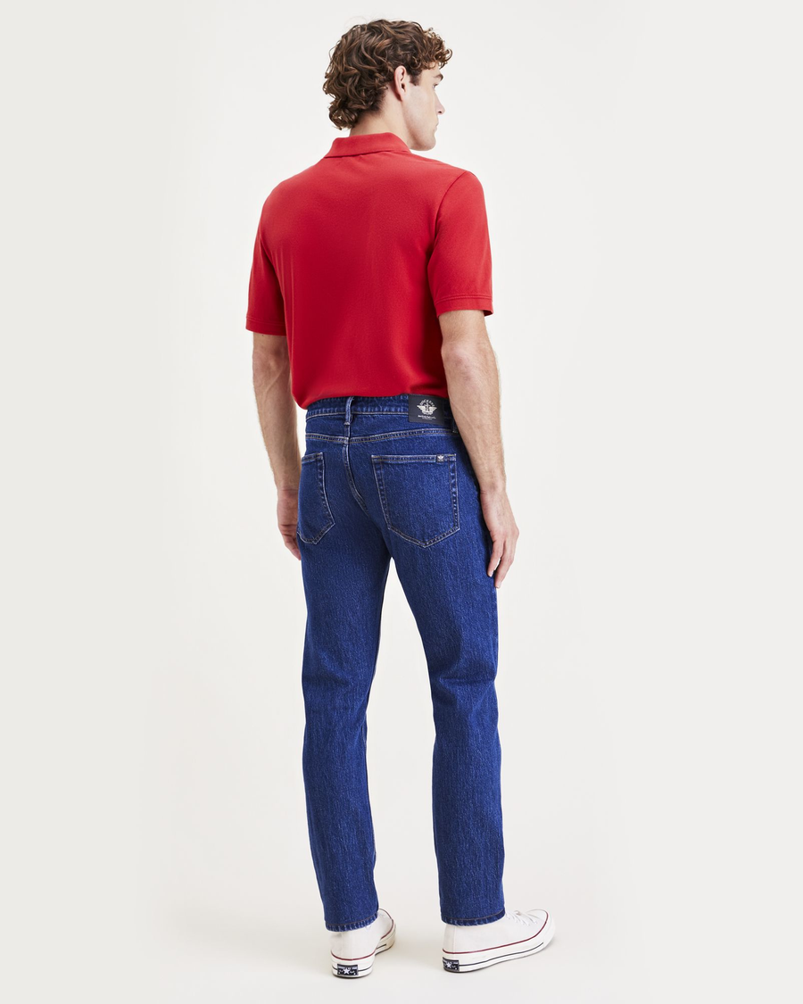 Back view of model wearing Dark Indigo Stonewash Jean Cut Pants, Slim Fit.