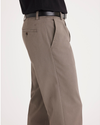Side view of model wearing Dark Pebble Easy Khakis, Classic Fit.