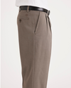 Side view of model wearing Dark Pebble Easy Khakis, Pleated, Classic Fit.