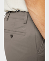 View of model wearing Dark Pebble Easy Khakis, Slim Fit.
