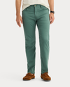 View of model wearing Duck Green Jean Cut Pants, Straight Fit.