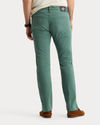 View of model wearing Duck Green Jean Cut Pants, Straight Fit.