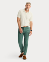 View of model wearing Duck Green Jean Cut Pants, Straight Fit.