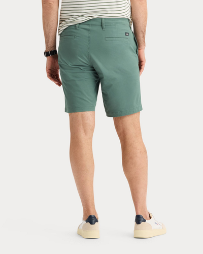 Back view of model wearing Duck Green Ultimate 9.5" Shorts, Straight Fit.