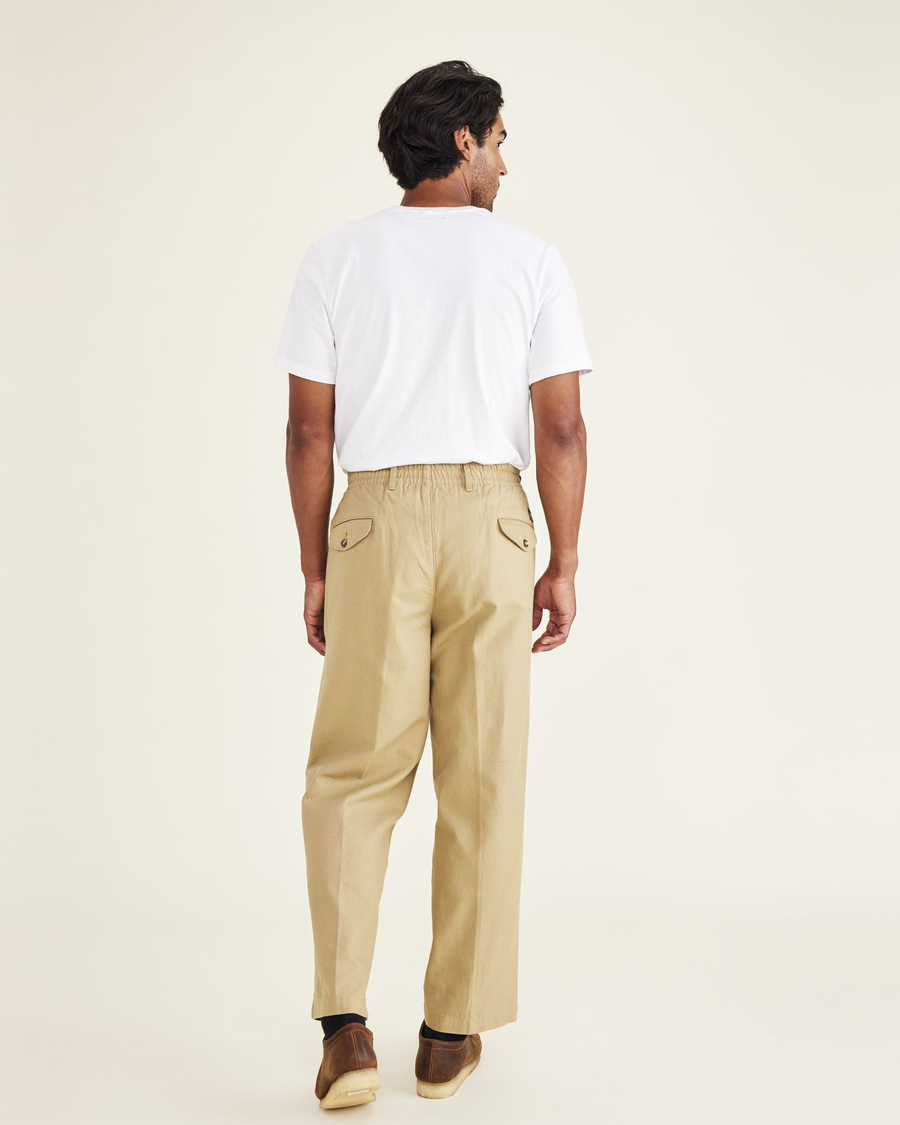 Back view of model wearing Harvest Gold Dockers® x Transnomadica Original Khakis, Pull-On.