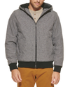 Front view of model wearing Heather Grey Zip Up Softshell Hoodie.