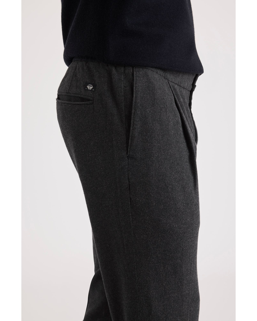 Side view of model wearing Jubilee Asphalt Crafted Pull-On Pants, Slim Tapered Fit.