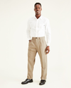 View of model wearing Khaki Easy Khakis, Pleated, Relaxed Fit.