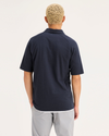 Back view of model wearing Navy Blazer Go Raglan Polo, Regular Fit.