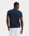 Back view of model wearing Navy Blazer Go Tee, Slim Fit.