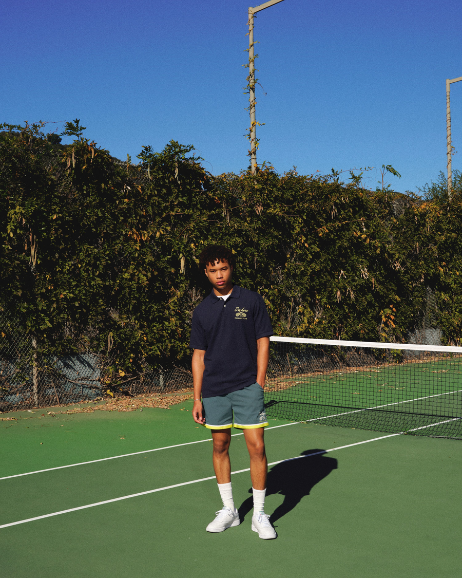 View of model wearing Navy Blazer Racquet Club Polo, Regular Fit.