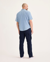 Back view of model wearing Navy Blazer Utility Cargo Pant, Straight Fit.