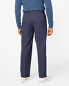 Back view of model wearing Navy Comfort Khakis, Pleated, Relaxed Fit.