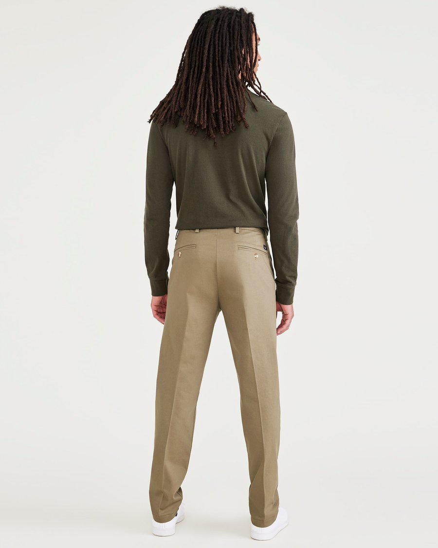 Back view of model wearing New British Khaki Signature Iron Free Khakis, Slim Fit with Stain Defender®.