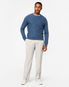 View of model wearing Porcelain Khaki Comfort Khakis, Pleated, Relaxed Fit.