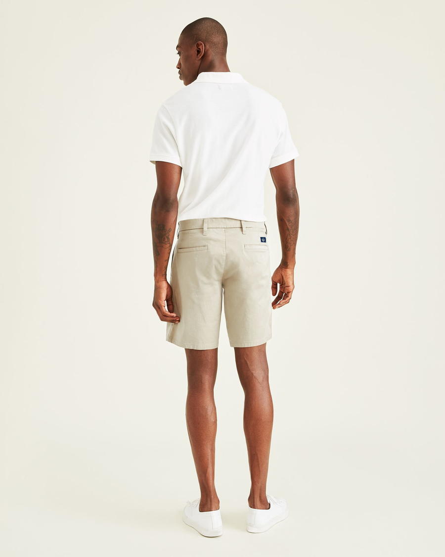 Back view of model wearing Porcelain Khaki Ultimate 9.5" Shorts.