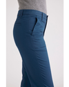 Side view of model wearing Poseideon Blue Weekend Chinos, Slim Fit.