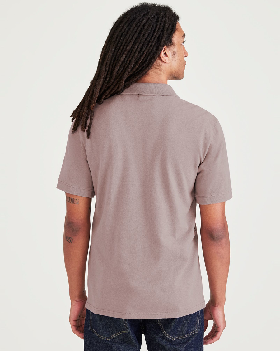 Back view of model wearing Purple Dove Rib Collar Polo, Slim Fit.