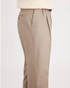 Side view of model wearing Timber Wolf Signature Khakis, Pleated, Classic Fit (Big and Tall).