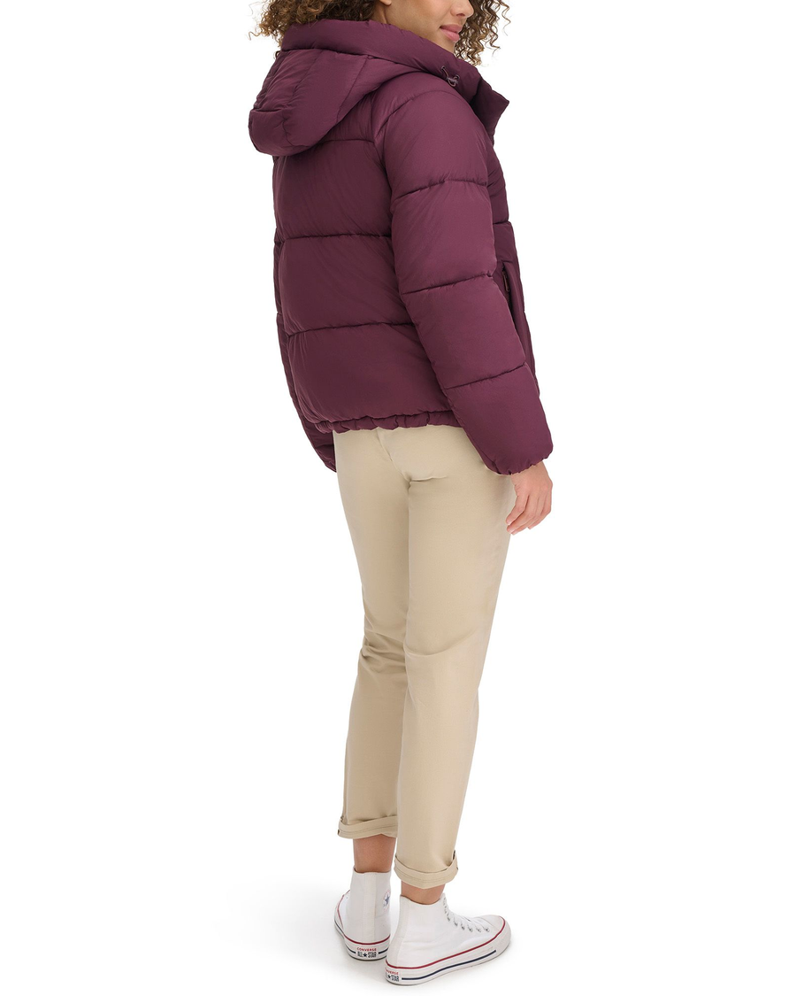 View of model wearing Winetasting Hooded Matte Bubble Puffer Jacket.